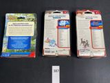 three boxes of pokemon cards are sitting on a table