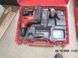 a red tool box with a hammer and other tools in it