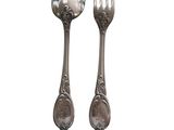 pair of silver plated spoons and fork on a white background