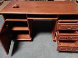 an image of a wooden desk with drawers and drawers