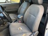 the interior of a car with the front seats folded down