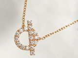 gold plated necklace with a diamond letter d on a gold chain