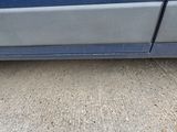 a close up of a car ' s side door with the door handle missing