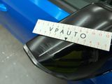 a close up of a sticker on the side mirror of a blue car