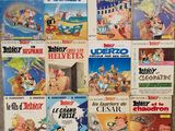 a lot of cartoon books on display on the wall
