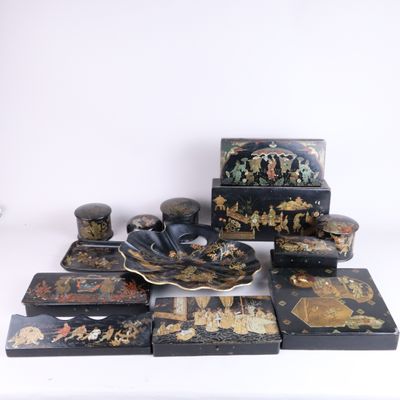 a lot of black and gold items sitting on a white surface