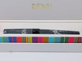 an open box with a pair of scissors in it on a table