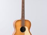 an image of a guitar hanging from a string on a wall