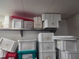 many boxes stacked on top of each other in a room