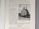 an open book with a picture of a church on it