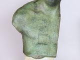 an image of a sculpture of a man ' s head on top of a wooden base