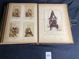 an old book with pictures of people sitting on a chair