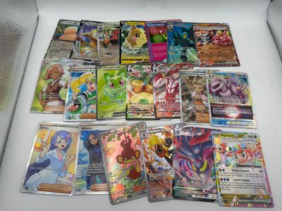 a lot of pokemon cards sitting on a table