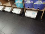 many boxes of toilet paper on the shelves in the store