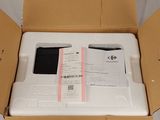 a box with a phone inside of it on the floor