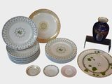 a lot of plates that are sitting on a table