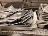 many pans and pans on the counter in the kitchen