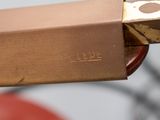 a close up of a pair of scissors with a box on it