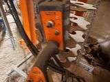 a machine that is working on a piece of wood