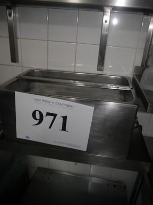 a metal sink with a price tag on it in a kitchen