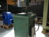 a machine that is sitting on a pallet in a warehouse