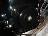 a black car that is parked in a garage