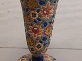 a vase that is sitting on a table in a room
