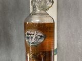 an image of a bottle of whisky sitting on top of a counter