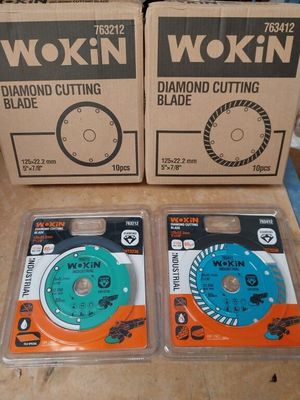 two boxes of wokin diamond cutting blades sitting on top of a table