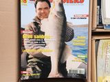 a magazine with a picture of a man holding a fish