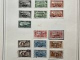 a framed picture of a collection of postage stamps on a white background