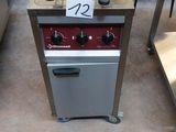 an image of a commercial fryer with a basket on top of it