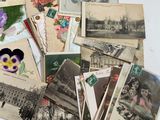 a lot of old postcards on the table