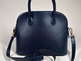the person in navy blue leather