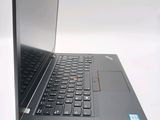 a close up of a laptop on a white surface