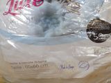 a bag of toilet paper that is wrapped in plastic