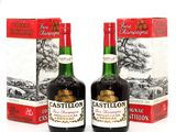 deux bouteilles de vin posées l'une à côté de l'autre sur une table