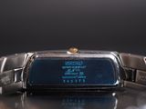 a close up of a watch on a table