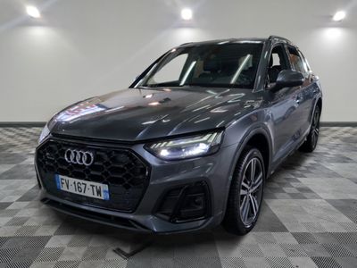 a grey audi suv parked on a checkered floor in a showroom