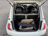 the back of a car with its trunk open and a box in the trunk