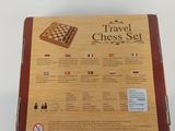 a box with a chess set inside of it on a table