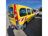 a yellow van that is parked in a parking lot
