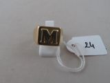 an image of a gold ring with the letter m on it
