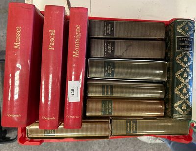 a lot of books that are sitting on a shelf