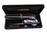 a pen and a wallet in a black box