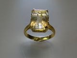 a close up of a ring on a table with a light shining on it
