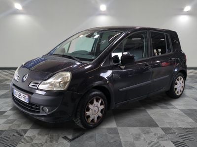 a picture of a small black van parked in a garage