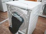 a white washer and dryer sitting in a room