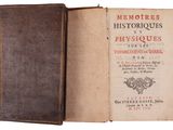 an old book opened to show the title of a book