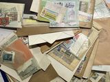 a pile of mail sitting on top of a table
